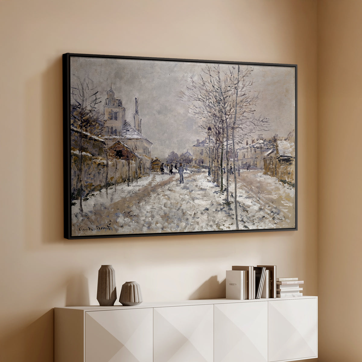Black floater framed canvas of The Boulevard de Pontoise at Argenteuil, Snow Effect, 1875 by Claude Monet, featuring an impressionist winter scene with road and bare trees above a console cabinet in a minimalist entryway.