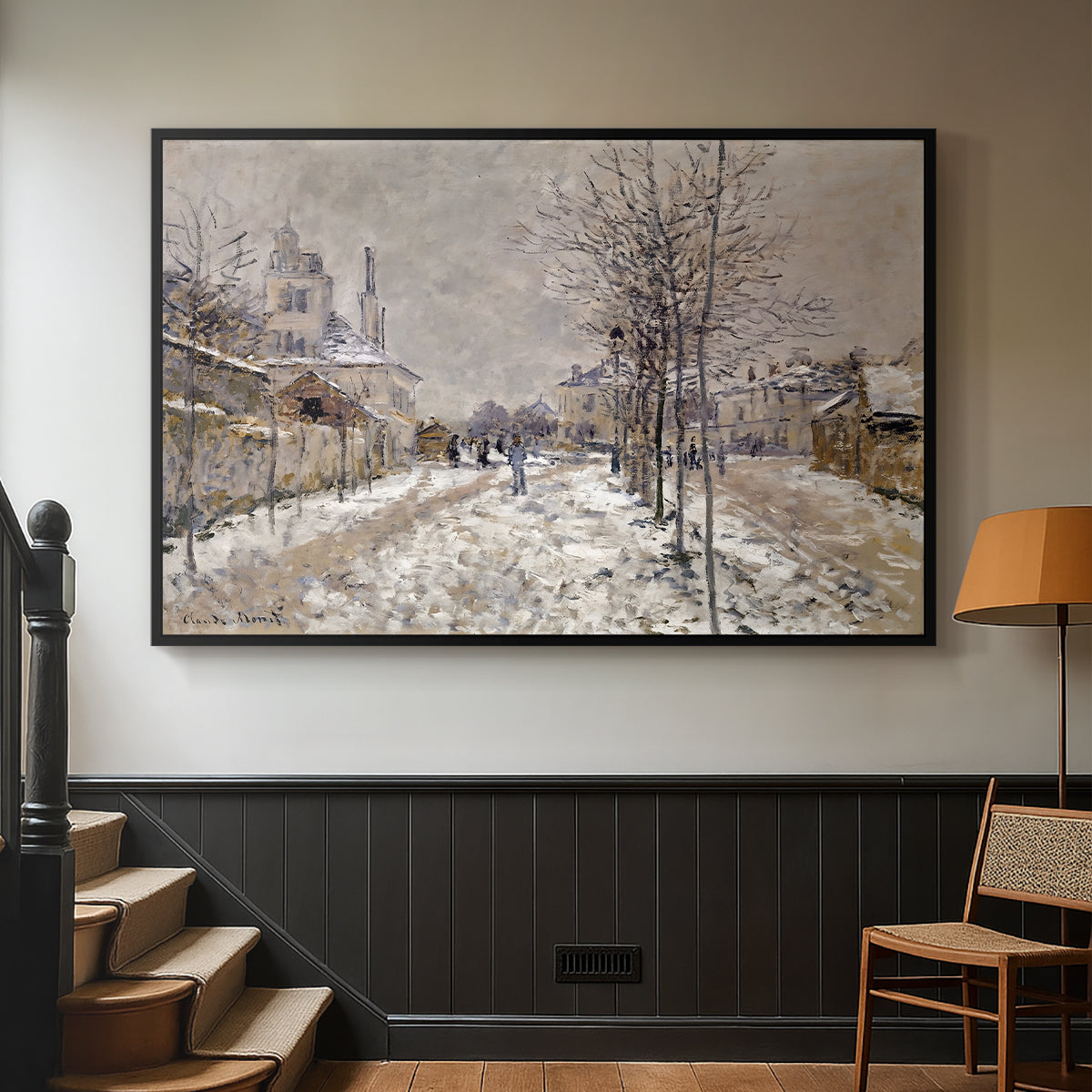 Black floater framed canvas featuring an urban winter landscape with muted tones and soft light, displayed in a hallway near a staircase.