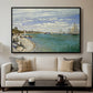 Regatta at Sainte-Adresse, 1867 by Claude Monet displayed in a black floater framed canvas above a sofa in a clean living room.