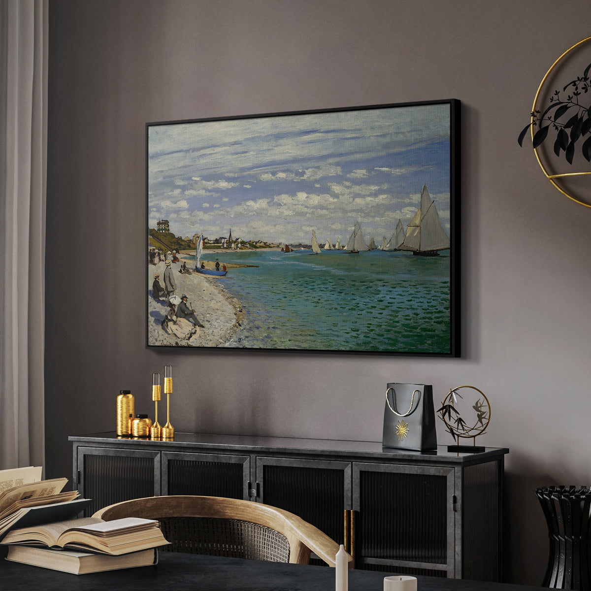 Regatta at Sainte-Adresse, 1867 by Claude Monet in a black floater framed canvas featuring an impressionist coastal view with colorful sails and shoreline activity, displayed above a desk in a dark home office interior.