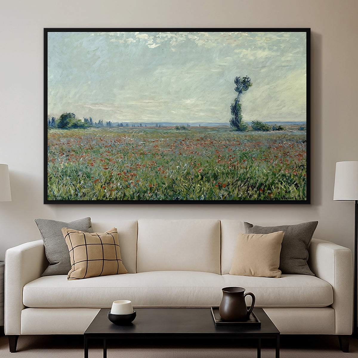 Poppy Field, 1881 by Claude Monet displayed in a black floater framed canvas above a sofa in a clean living room.