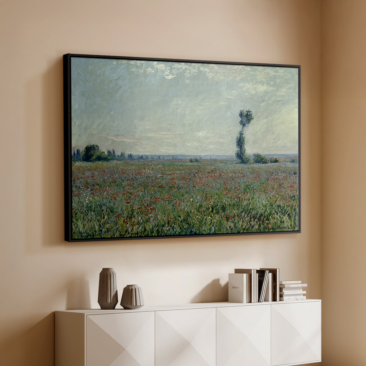 Black floater framed canvas of Poppy Field, 1881 by Claude Monet, featuring an impressionist landscape filled with blooming flowers and greenery above a console cabinet in a minimalist entryway.