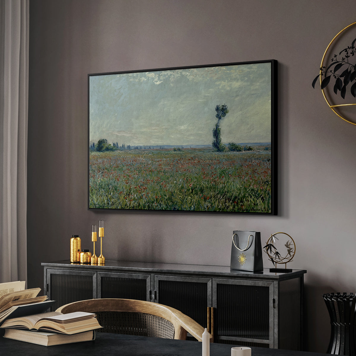 Poppy Field, 1881 by Claude Monet in a black floater framed canvas featuring a rural meadow with scattered poppies and soft horizon, displayed above a desk in a dark home office interior.