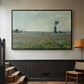 Black floater framed canvas featuring a natural field scene with vibrant red flowers, displayed in a hallway near a staircase.