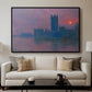 The Houses of Parliament, Sunset, 1903 by Claude Monet displayed in a black floater framed canvas above a sofa in a clean living room.