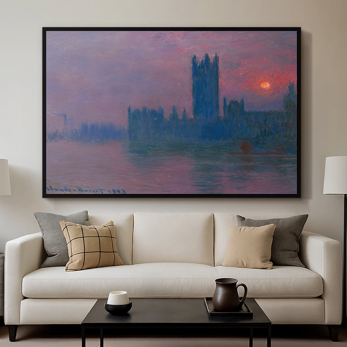 The Houses of Parliament, Sunset, 1903 by Claude Monet displayed in a black floater framed canvas above a sofa in a clean living room.
