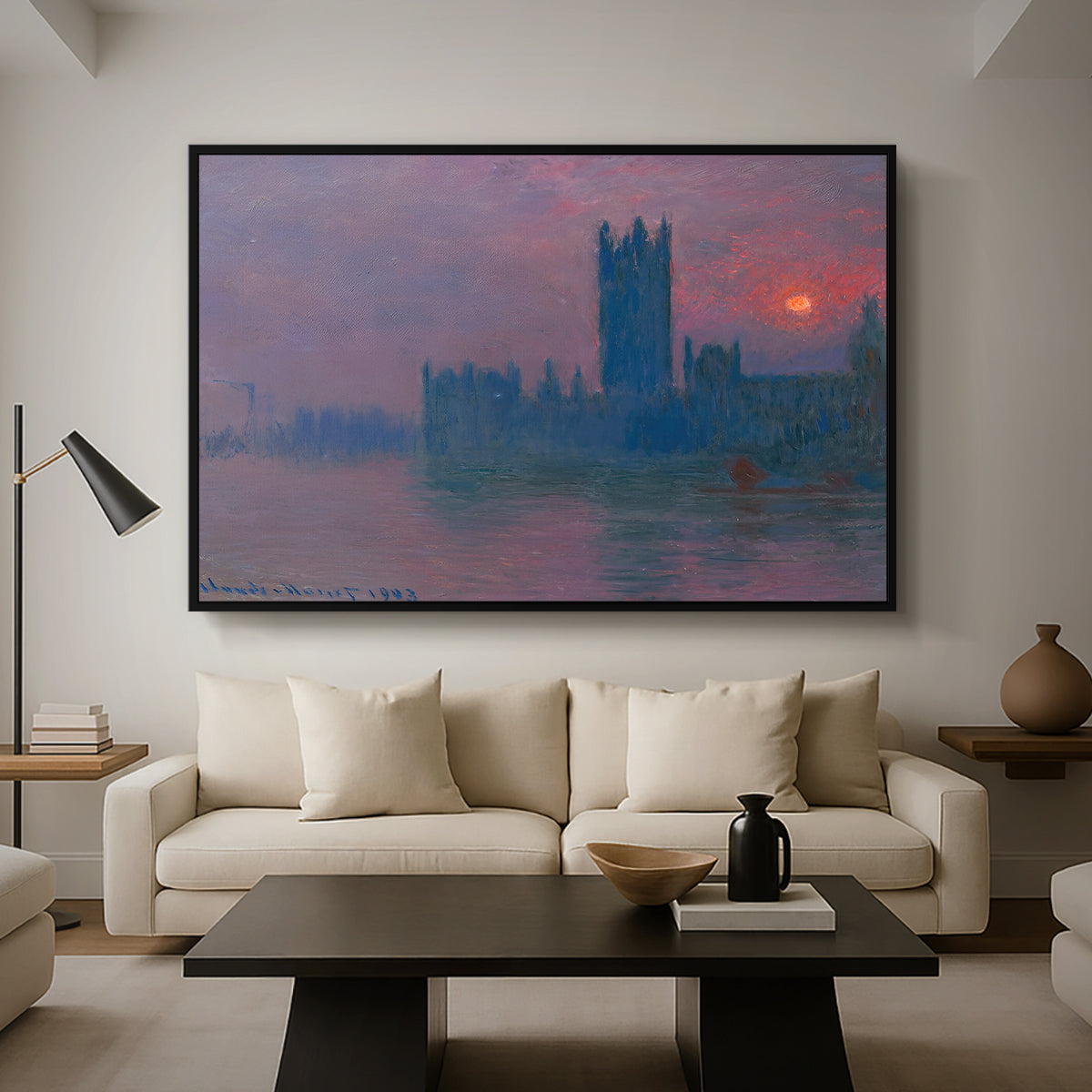 The Houses of Parliament, Sunset, 1903 by Claude Monet as a black floater framed canvas featuring a silhouette of Parliament buildings against glowing sunset across river, displayed above a sofa in a modern living room.