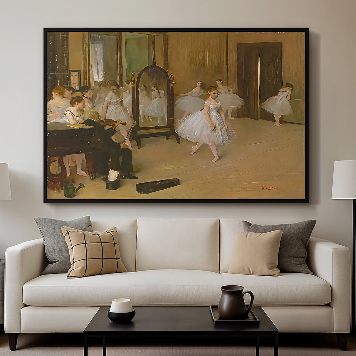 The Dancing Class, c. 1870 by Edgar Degas displayed in a black floater framed canvas above a sofa in a clean living room.