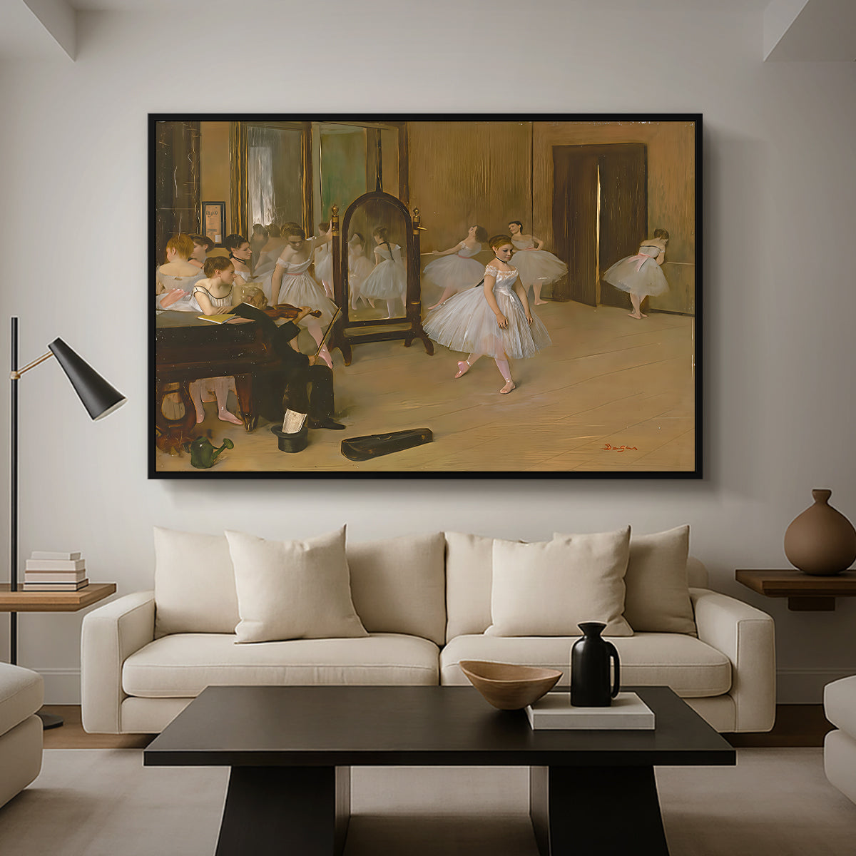 The Dancing Class, c. 1870 by Edgar Degas as a black floater framed canvas featuring a ballet class with dancers practicing positions under instructor guidance, displayed above a sofa in a modern living room.