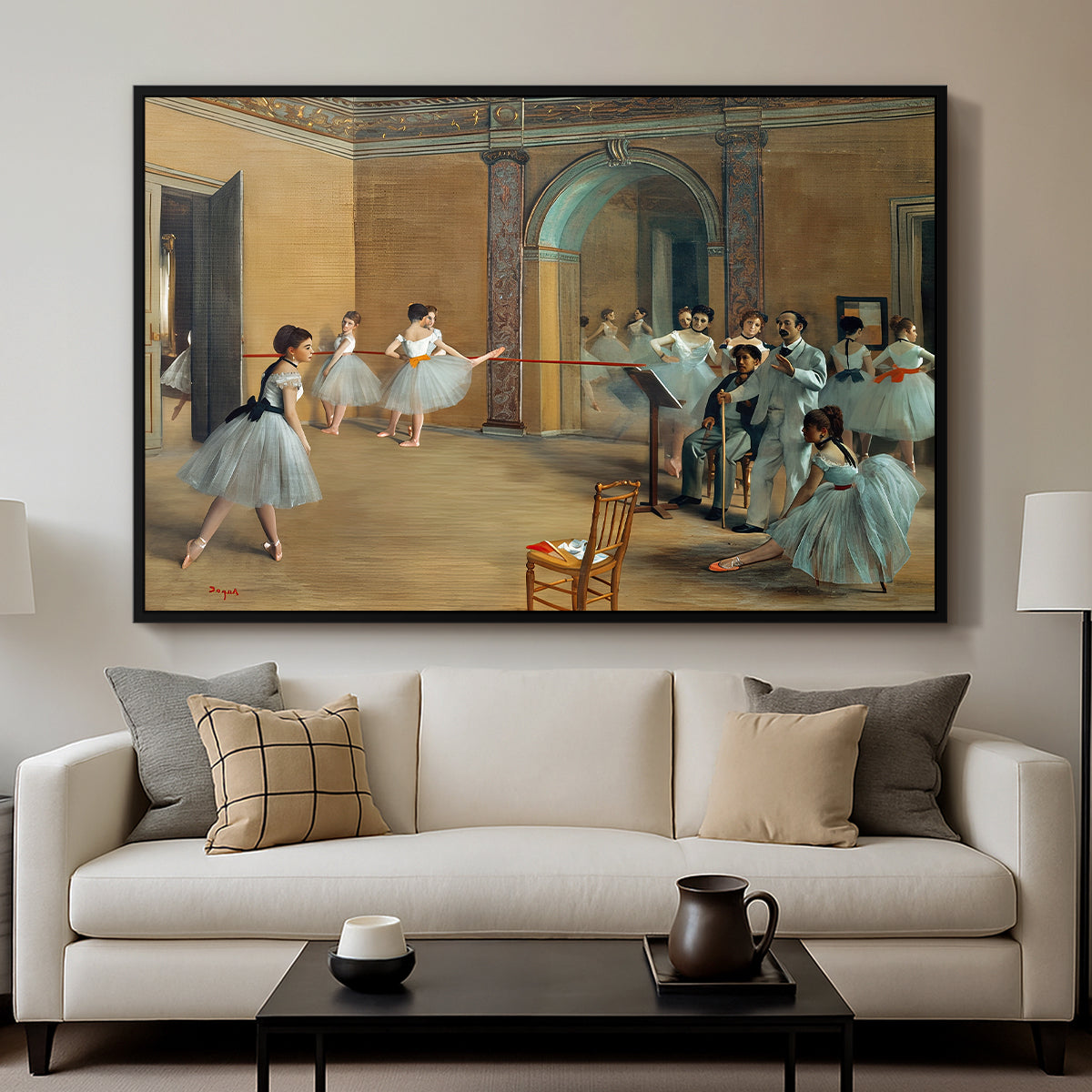 The Dance Foyer at the Opera on the Rue Le Peletier, 1872 by Edgar Degas displayed in a black floater framed canvas above a sofa in a clean living room.