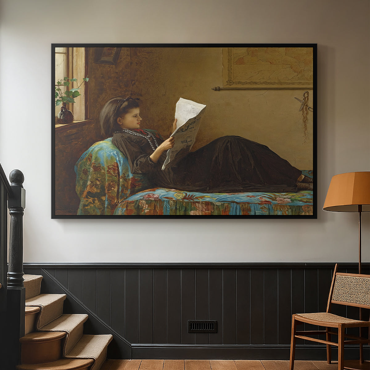 Black floater framed canvas featuring a casual gathering around newspaper in rustic room, displayed in a hallway near a staircase.