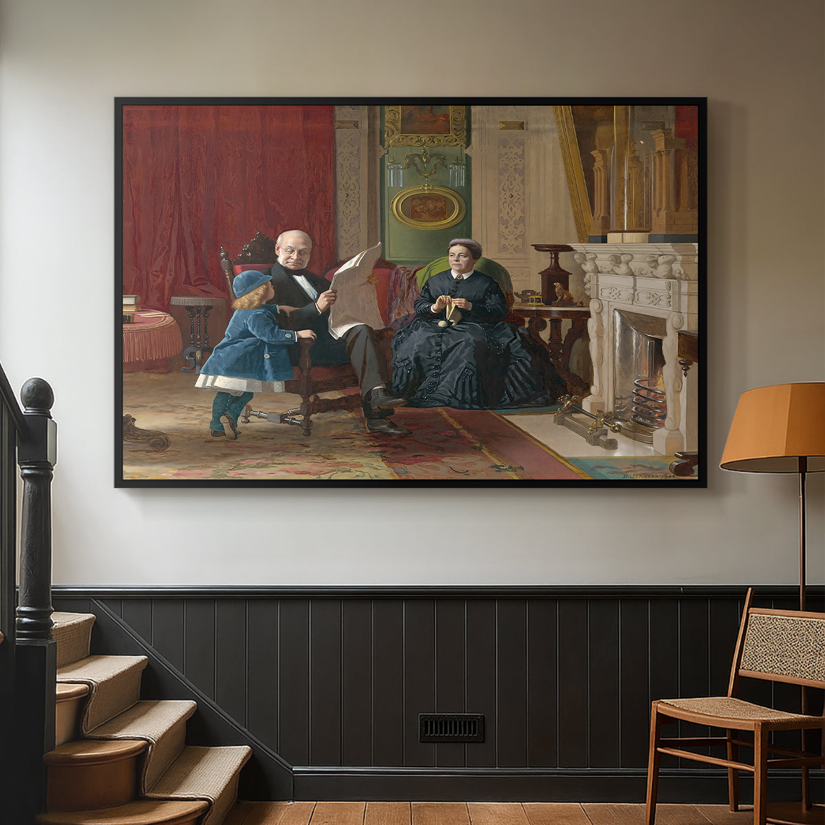 Black floater framed canvas featuring a family group portrait with warm interior tones, displayed in a hallway near a staircase.