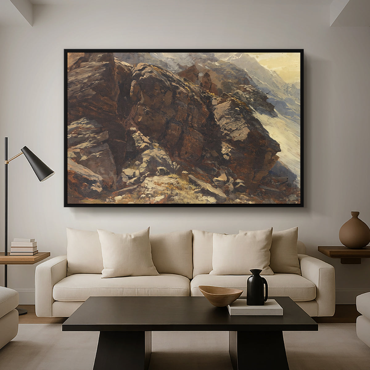 High Mountain Study, c. 1870 by Edward Theodore Compton as a black floater framed canvas featuring a rocky alpine terrain with steep slopes and distant mountain peaks, displayed above a sofa in a modern living room.