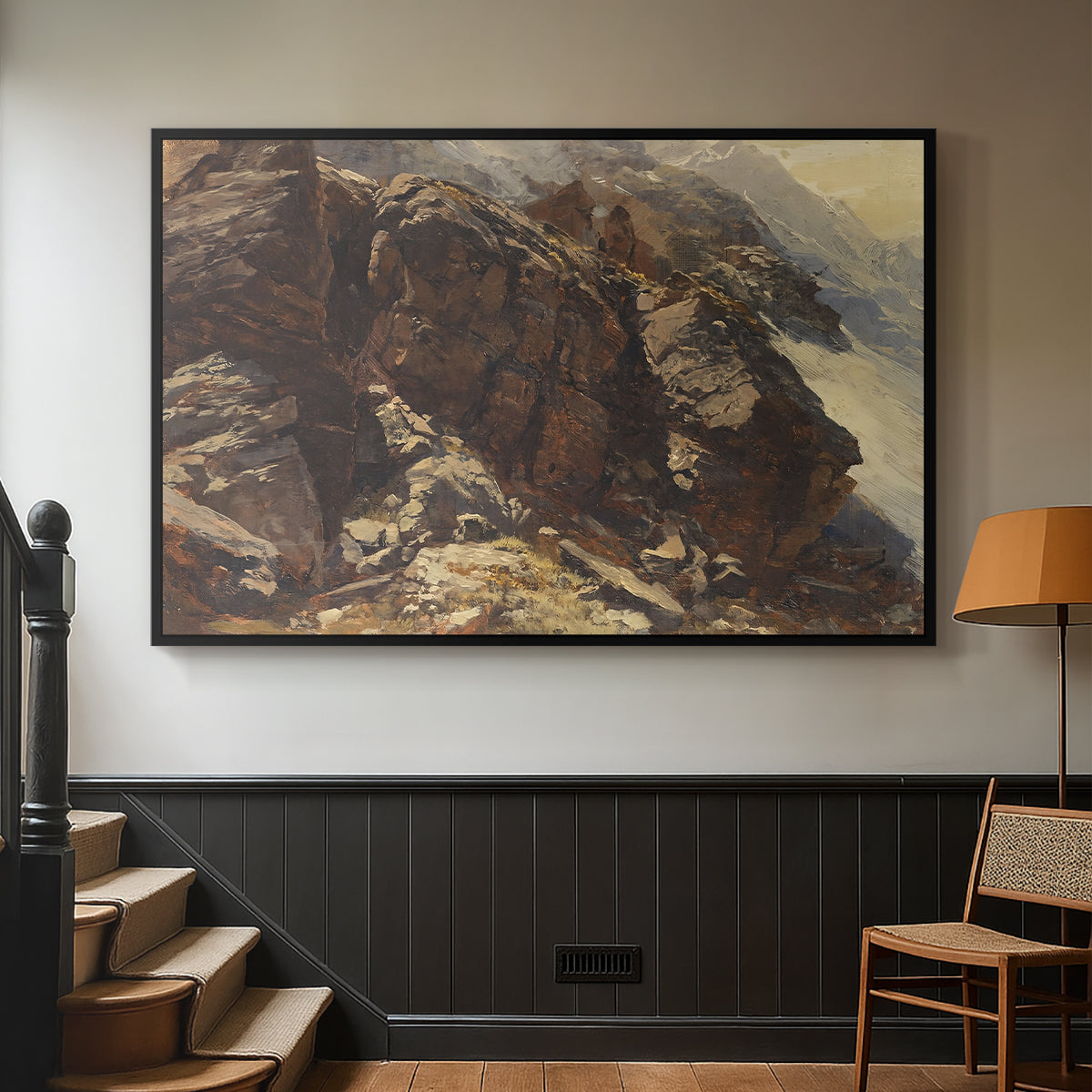 Black floater framed canvas featuring a realistic depiction of mountainous terrain under open sky, displayed in a hallway near a staircase.