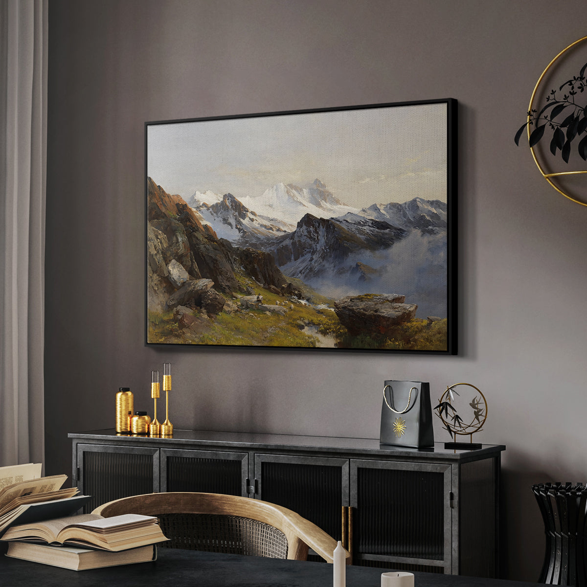 The Großglockner from the Prager Hut, 1890 by Edward Theodore Compton in a black floater framed canvas featuring an alpine vista with towering peak and foreground terrain, displayed above a desk in a dark home office interior.