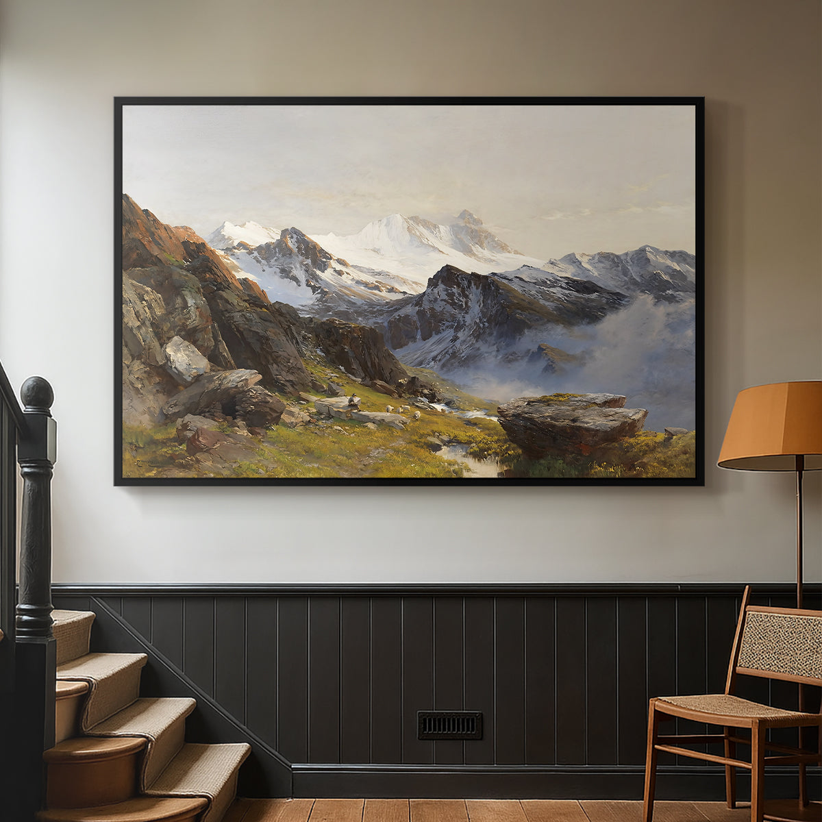 Black floater framed canvas featuring a scenic mountain view with dramatic elevation and depth, displayed in a hallway near a staircase.