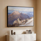 Black floater framed canvas of Hoher Göll from Watzmann-Hocheck, 1919 by Edward Theodore Compton, featuring an alpine panorama showing layered peaks and valleys above a console cabinet in a minimalist entryway.