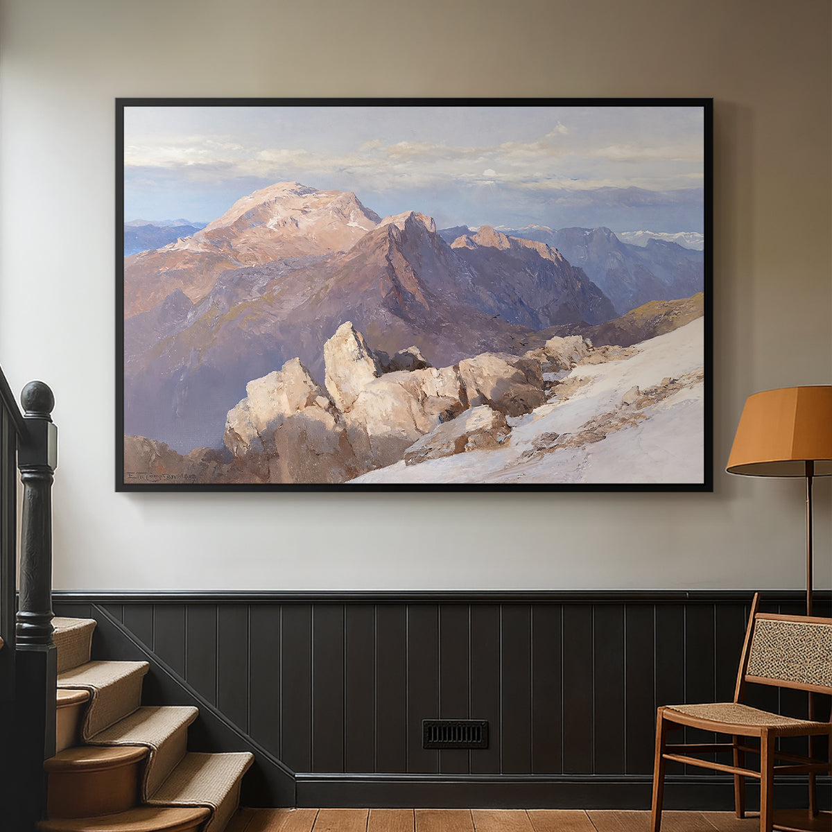 Black floater framed canvas featuring an expansive mountainous landscape with natural depth, displayed in a hallway near a staircase.