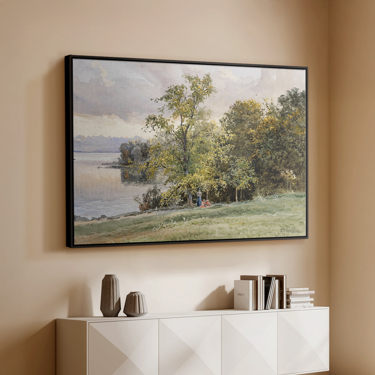 Black floater framed canvas of Landscape at Lake Starnberg, 1890 by Edward Theodore Compton, featuring a peaceful lake scene with reflections and surrounding greenery above a console cabinet in a minimalist entryway.