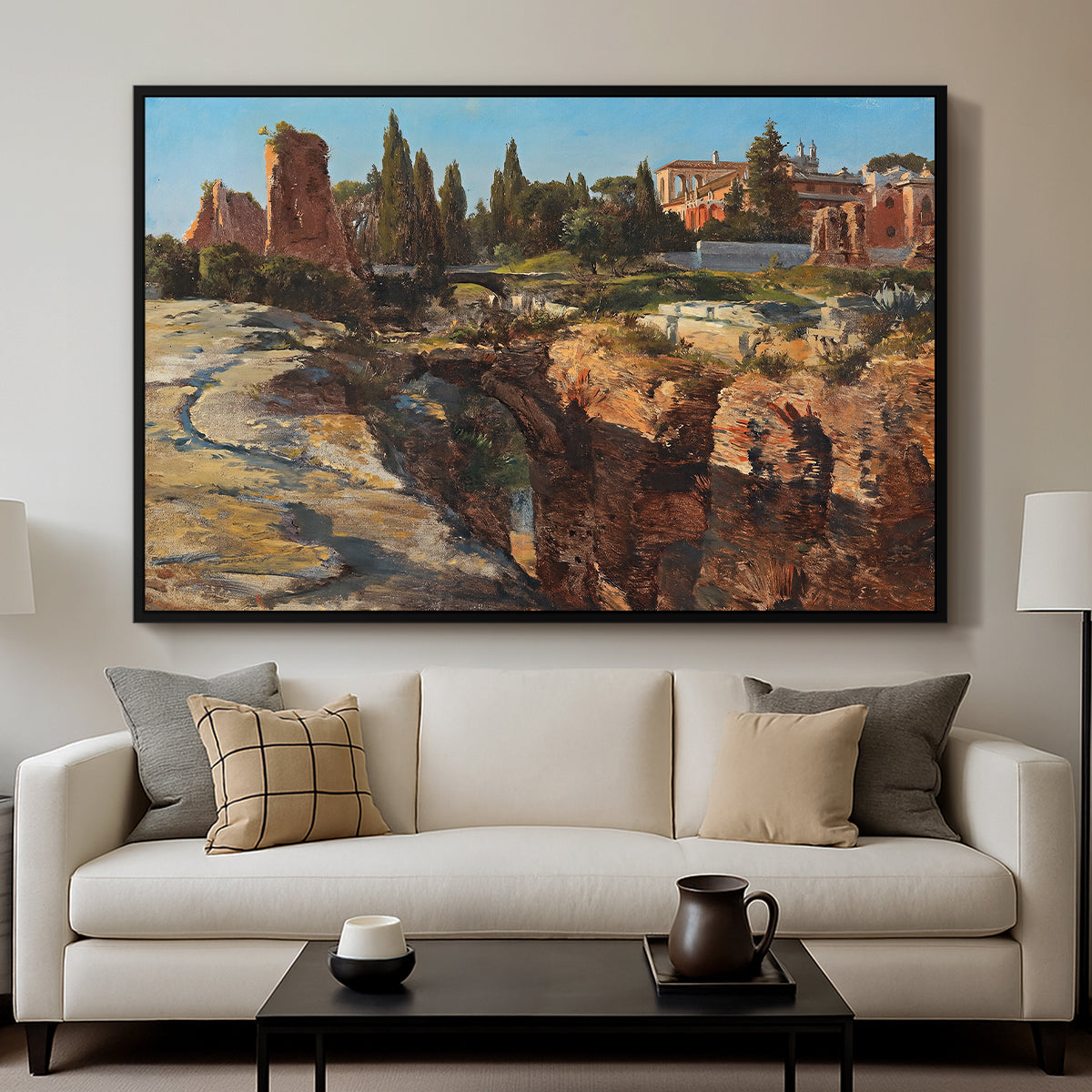 Palatine in Rome, c. 1921 by Edward Theodore Compton displayed in a black floater framed canvas above a sofa in a clean living room.