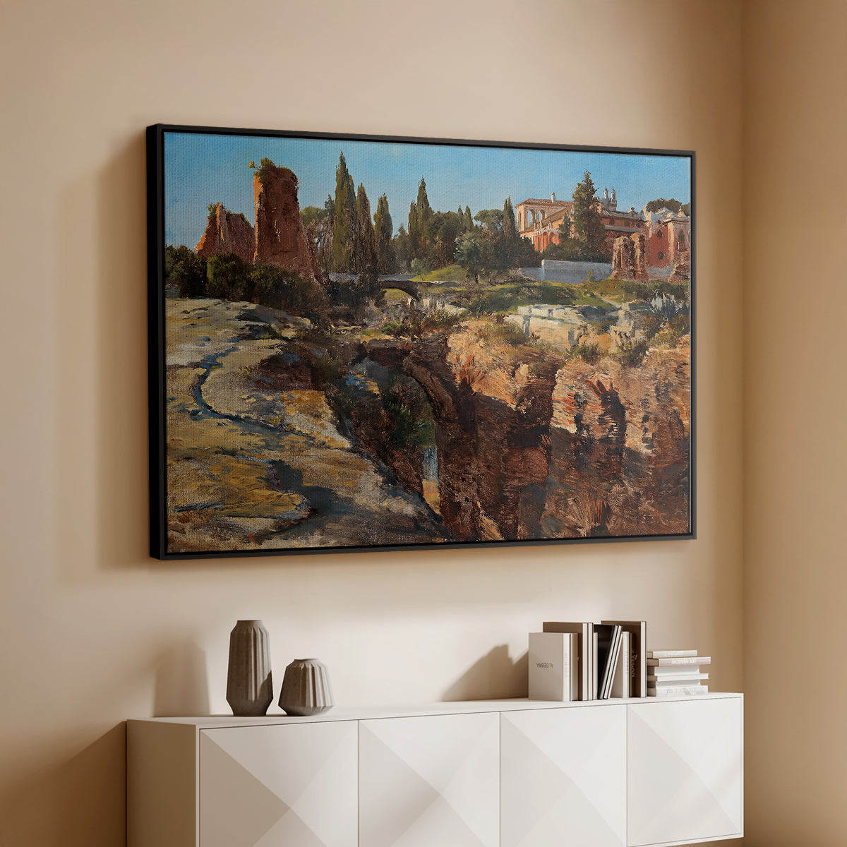 Black floater framed canvas of Palatine in Rome, c. 1921 by Edward Theodore Compton, featuring an architectural scene of ancient structures in sunlit environment above a console cabinet in a minimalist entryway.