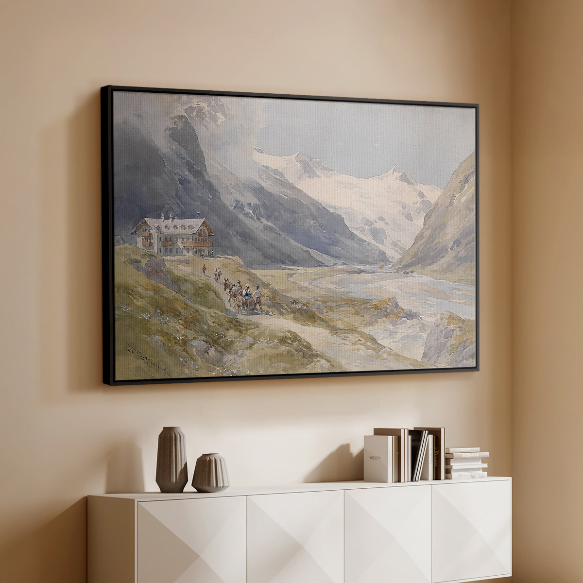 Black floater framed canvas of Shepherds (Pasterze), c. 1921 by Edward Theodore Compton, featuring a pastoral mountain scene with figures tending livestock above a console cabinet in a minimalist entryway.