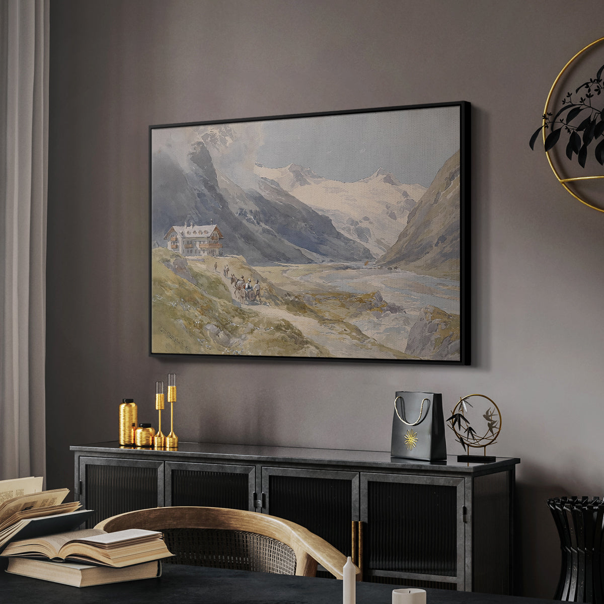 Shepherds (Pasterze), c. 1921 by Edward Theodore Compton in a black floater framed canvas featuring a rural alpine setting with shepherds and open terrain, displayed above a desk in a dark home office interior.