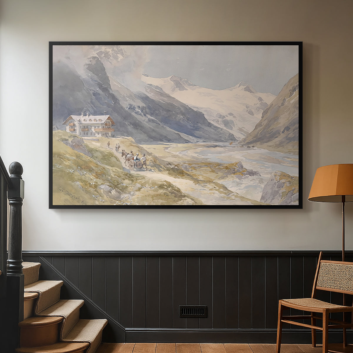 Black floater framed canvas featuring a natural landscape with human presence among mountains, displayed in a hallway near a staircase.