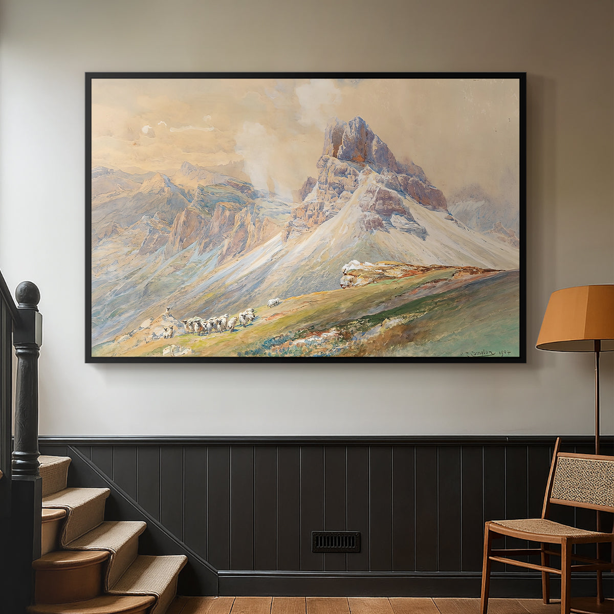 Black floater framed canvas featuring a realistic mountain view with strong geological forms, displayed in a hallway near a staircase.