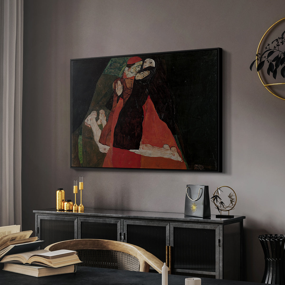 Cardinal and Nun (Caress), 1912 by Egon Schiele in a black floater framed canvas featuring an expressive painting of figures entwined with bold lines and color, displayed above a desk in a dark home office interior.