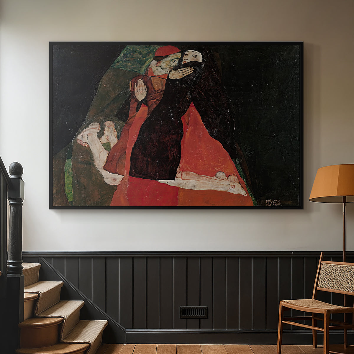 Black floater framed canvas featuring an intimate scene with religious figures in modernist style, displayed in a hallway near a staircase.