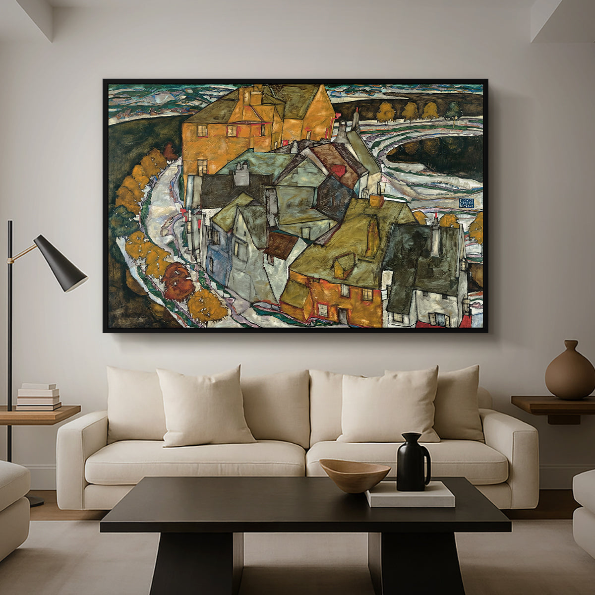 Crescent of Houses II (Island Town), 1915 by Egon Schiele as a black floater framed canvas featuring a curved row of colorful houses forming crescent shape along water, displayed above a sofa in a modern living room.