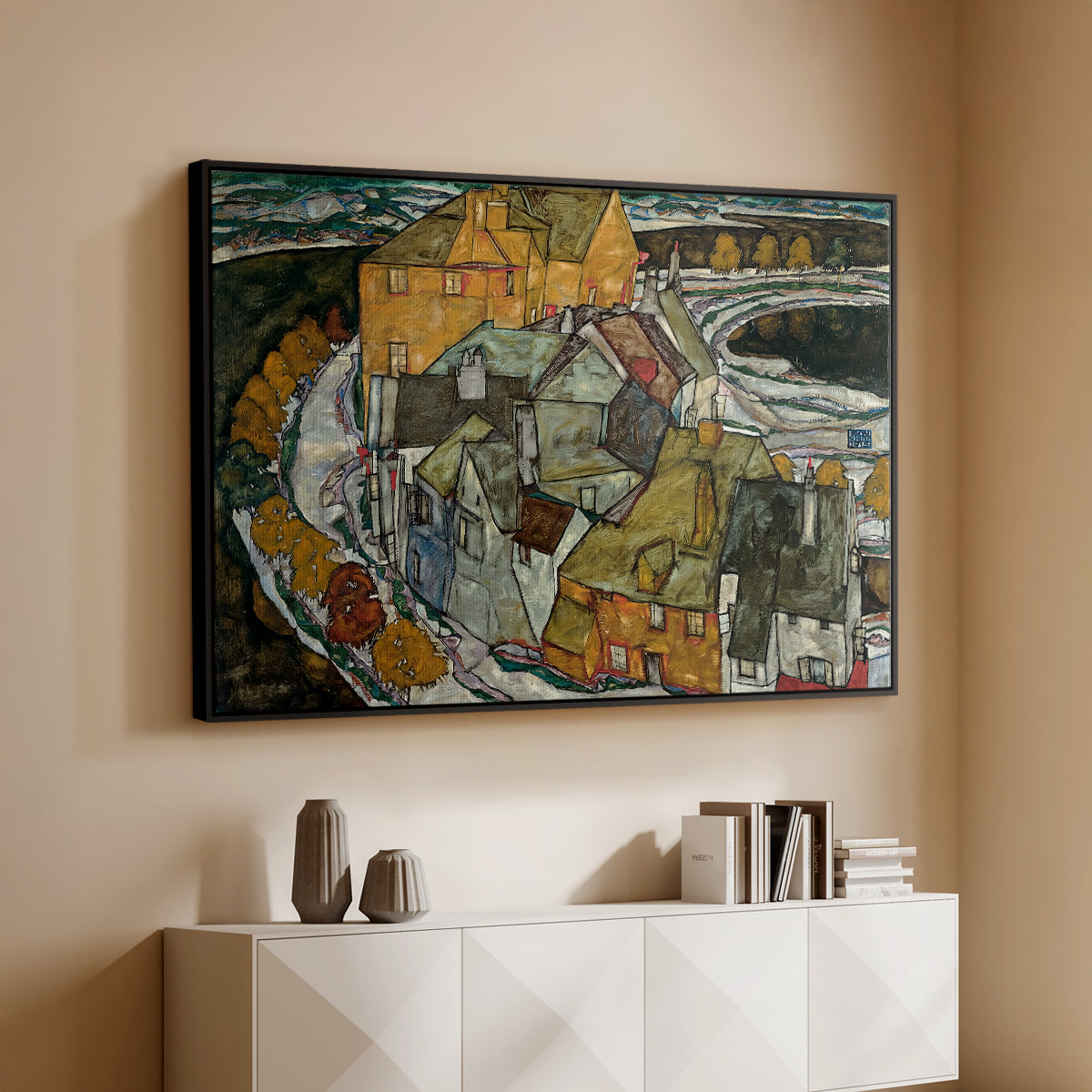 Black floater framed canvas of Crescent of Houses II (Island Town), 1915 by Egon Schiele, featuring a stylized townscape with clustered buildings and bold outlines above a console cabinet in a minimalist entryway.
