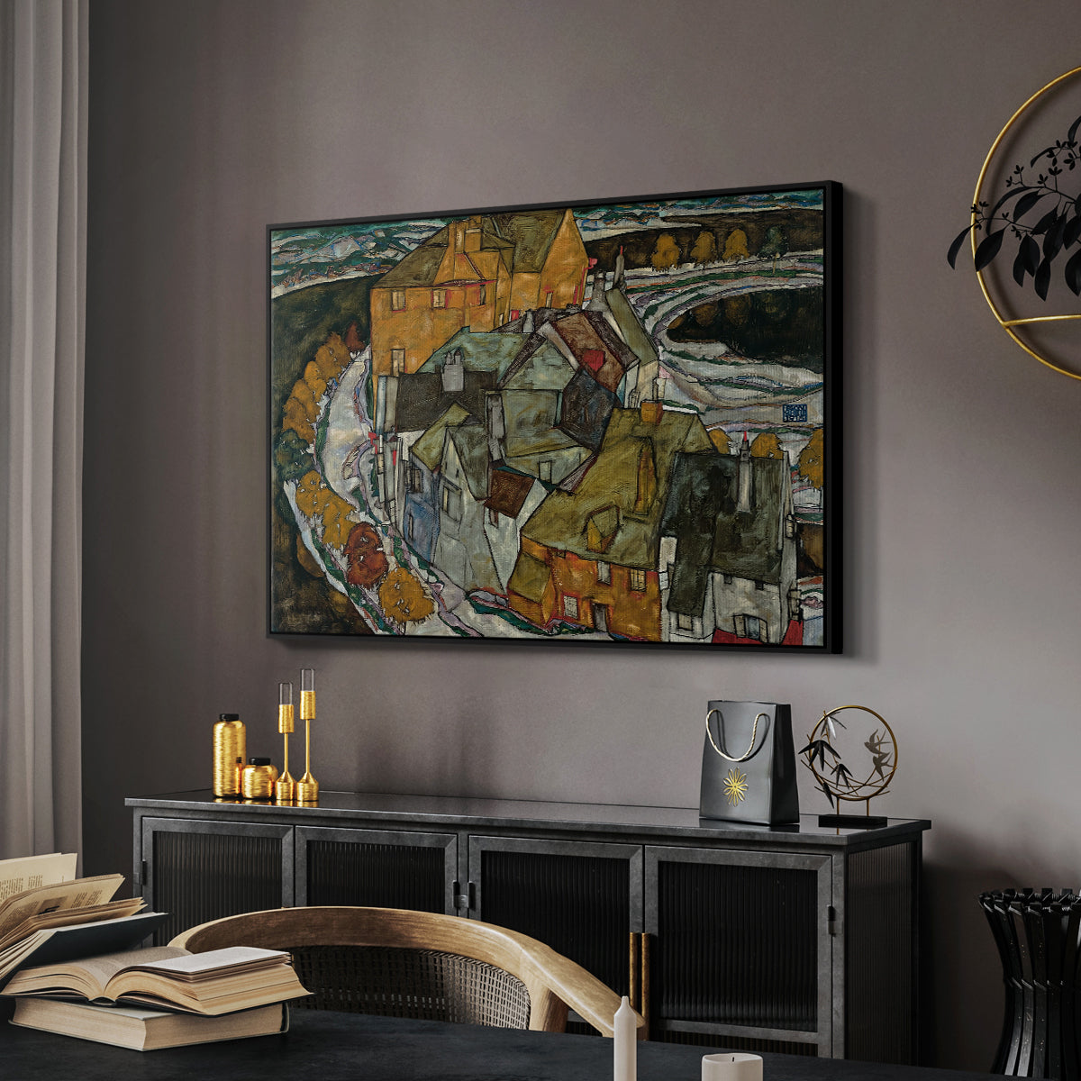 Crescent of Houses II (Island Town), 1915 by Egon Schiele in a black floater framed canvas featuring an expressionist depiction of island town with geometric forms, displayed above a desk in a dark home office interior.