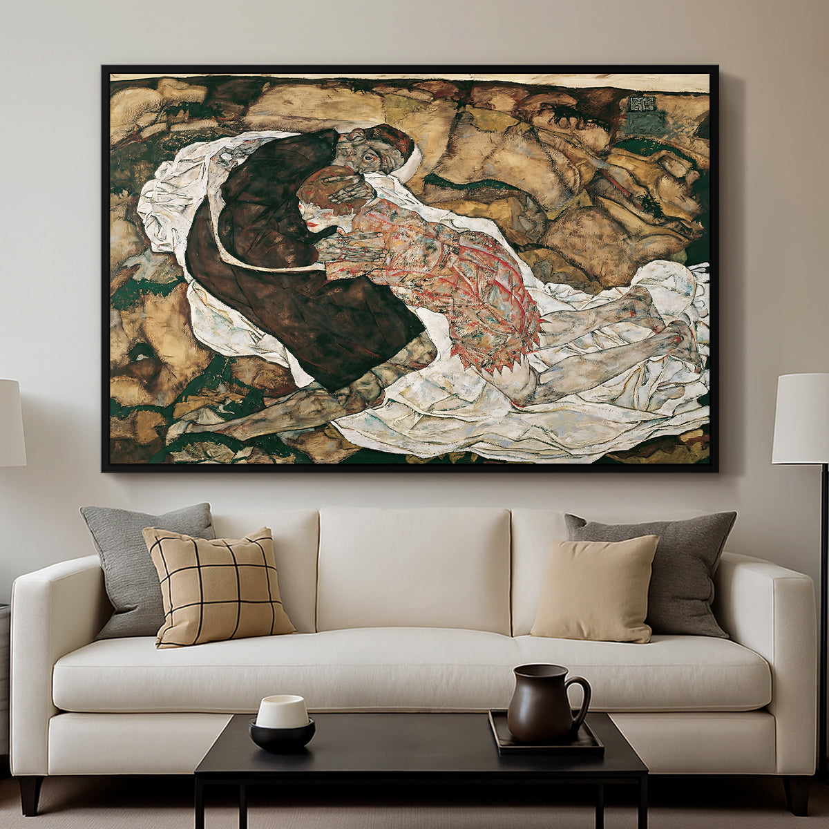 Death and the Maiden, 1915 by Egon Schiele displayed in a black floater framed canvas above a sofa in a clean living room.
