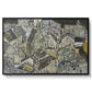 Mödling II, 1918 by Egon Schiele in a black floater framed canvas wall art display.