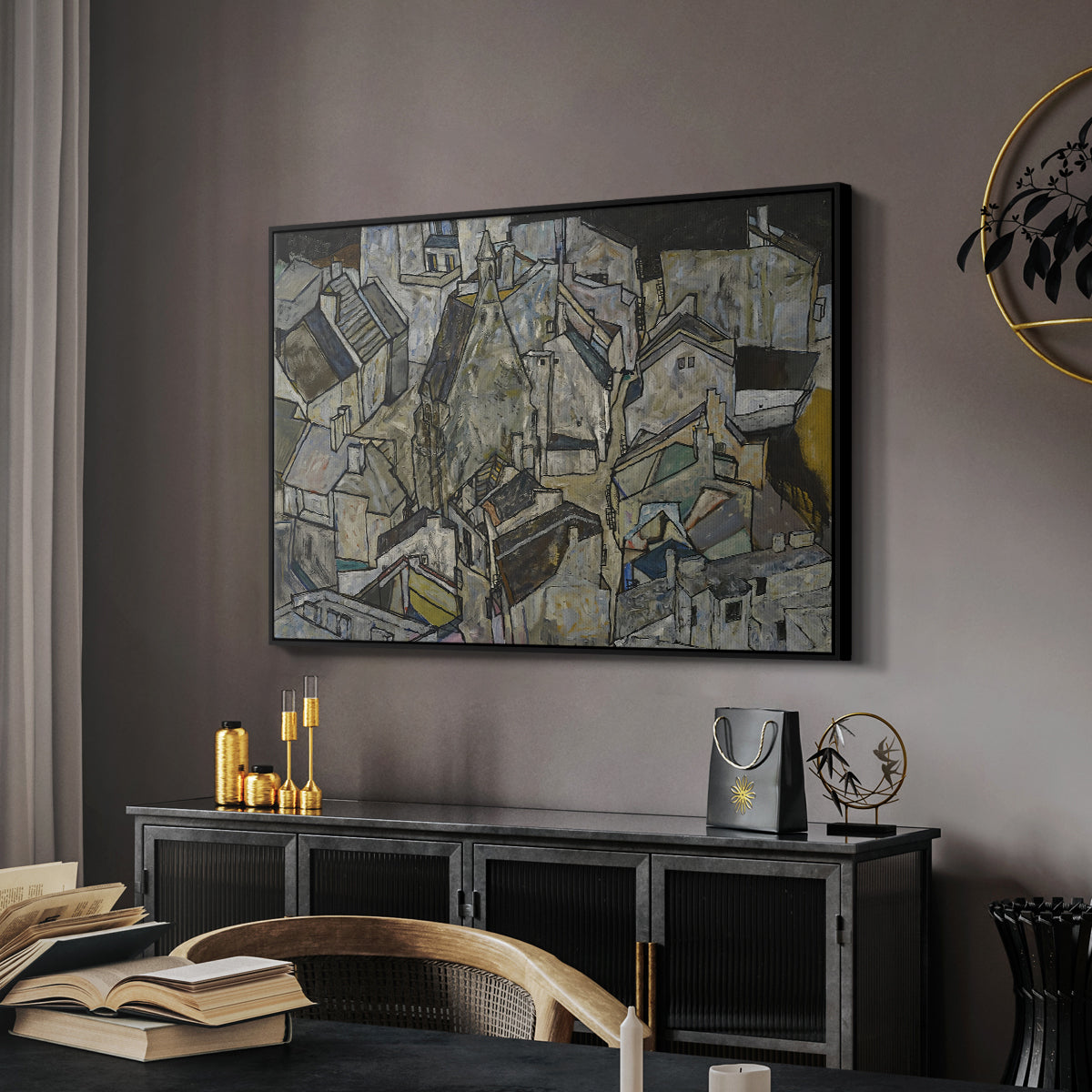 Mödling II, 1918 by Egon Schiele in a black floater framed canvas featuring an abstracted town view with angular rooftops and fragmented forms, displayed above a desk in a dark home office interior.
