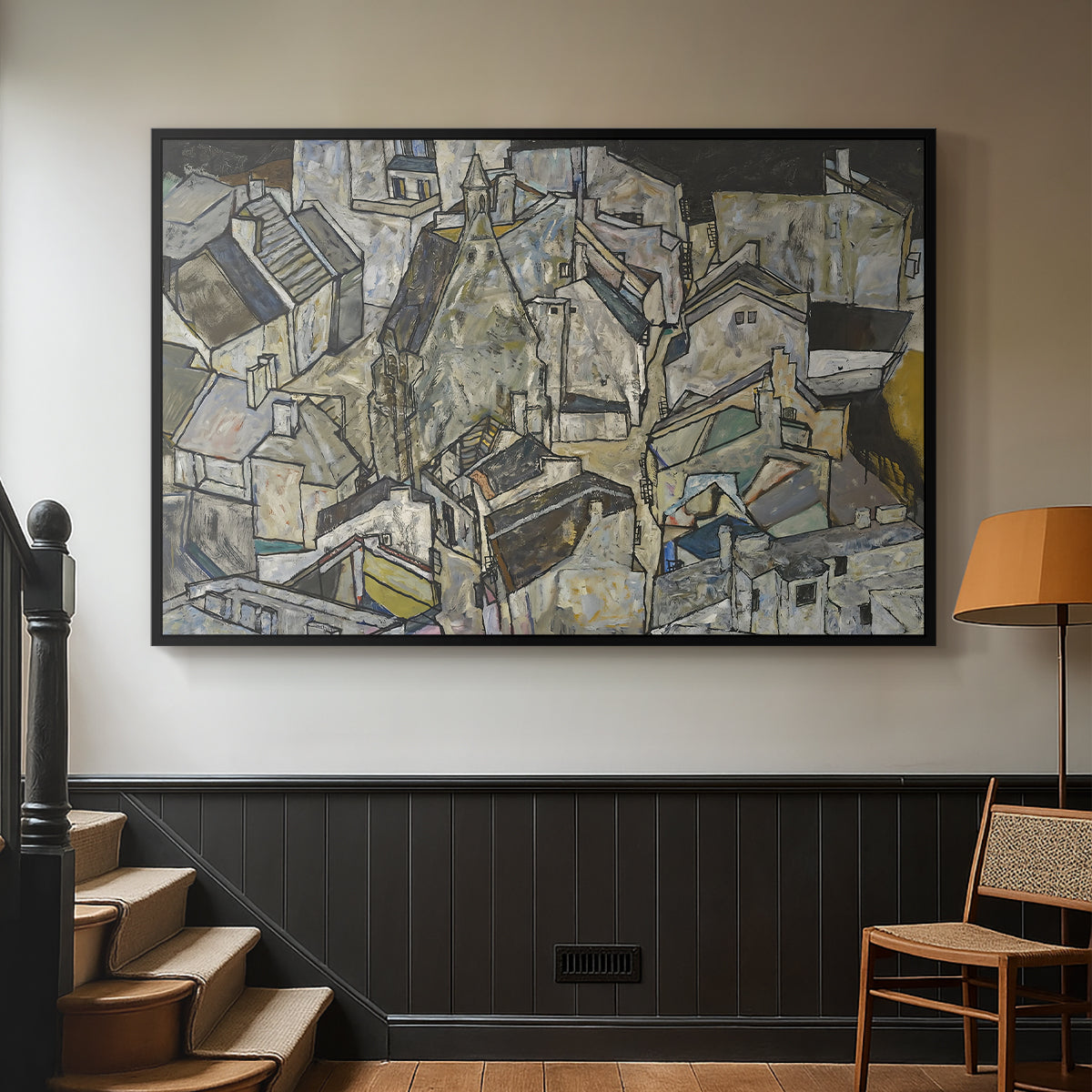 Black floater framed canvas featuring a stylized urban composition with geometric structures and muted tones, displayed in a hallway near a staircase.