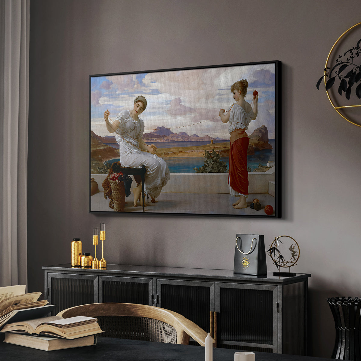 Winding the Skein, c. 1878 by Frederic Leighton in a black floater framed canvas featuring a classical scene of figures winding thread together, displayed above a desk in a dark home office interior.