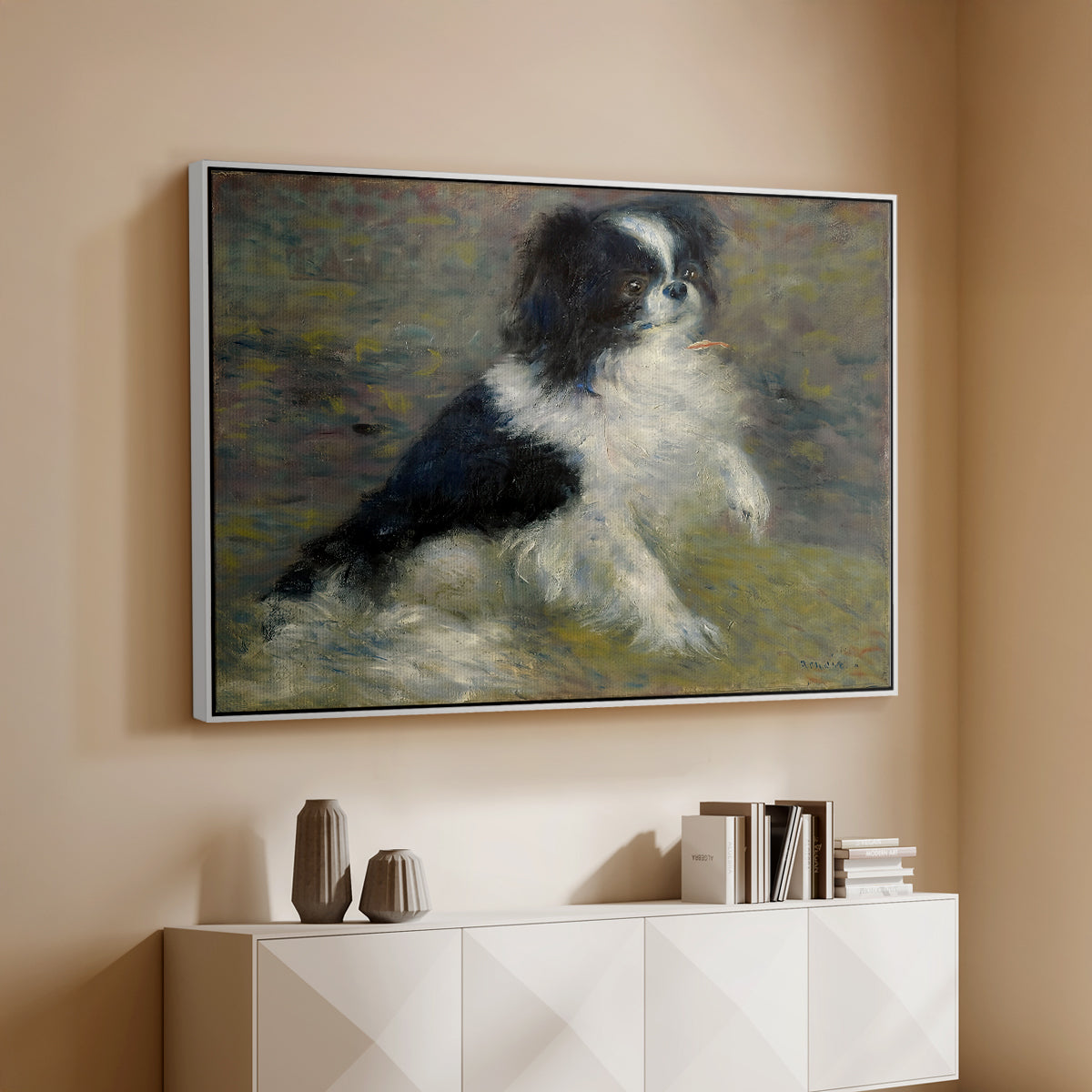 White floater framed canvas of Tama, the Japanese Dog, c. 1876 by Pierre-Auguste Renoir, featuring an impressionist painting of a dog wading through water with blurred background above a console cabinet in a minimalist entryway.