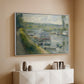 White floater framed canvas of Wash-House Boat at Bas-Meudon, c. 1874 by Pierre-Auguste Renoir, featuring a riverside scene with moored boat used for washing clothes above a console cabinet in a minimalist entryway.