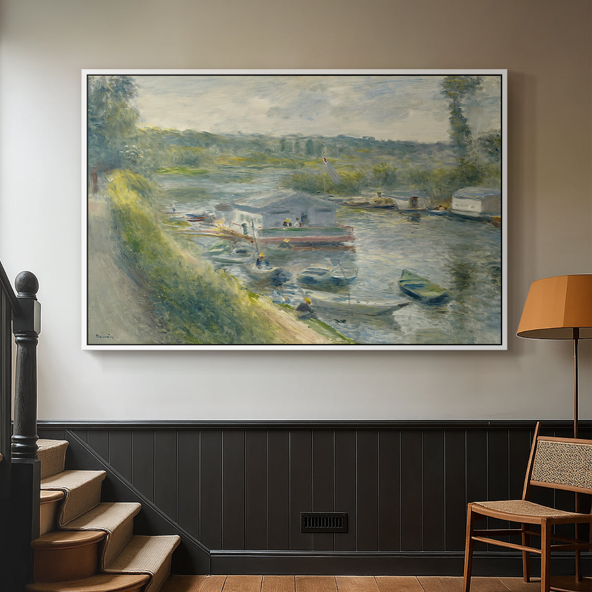 White floater framed canvas featuring an everyday life scene with boat and figures along river edge, displayed in a hallway near a staircase.