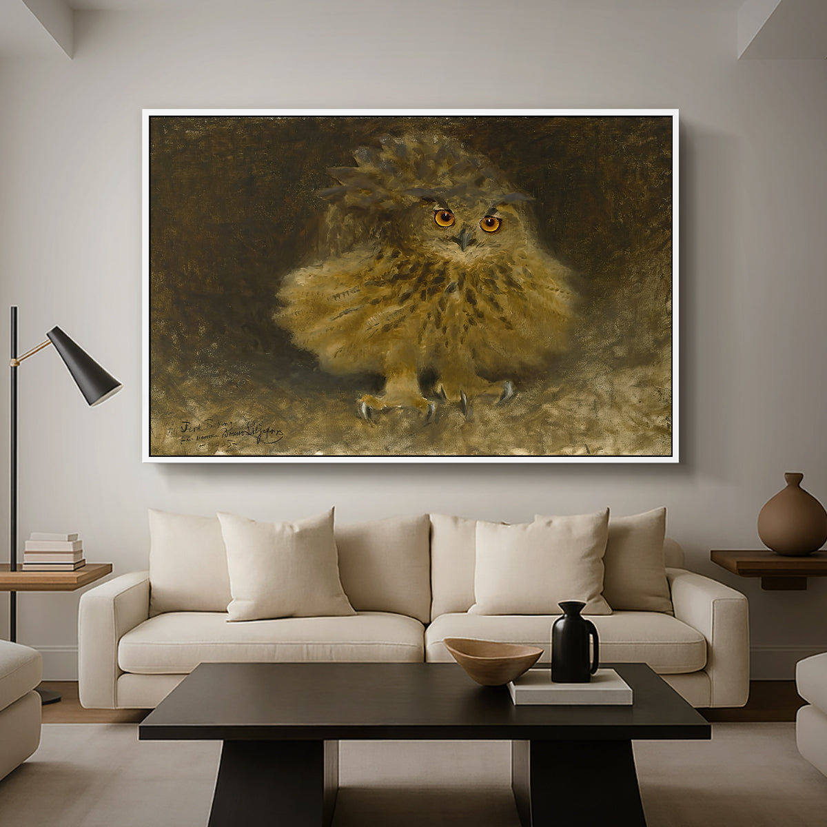 An Eagle Owl (Berguv), 1905 by Bruno Liljefors as a white floater framed canvas featuring a large owl perched on branch in shadowy natural forest setting, displayed above a sofa in a modern living room.