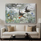 Common Swifts, 1886 by Bruno Liljefors displayed in a white floater framed canvas above a sofa in a clean living room.