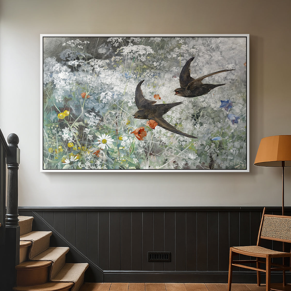 White floater framed canvas featuring an impressionist wildlife scene capturing birds in motion, displayed in a hallway near a staircase.