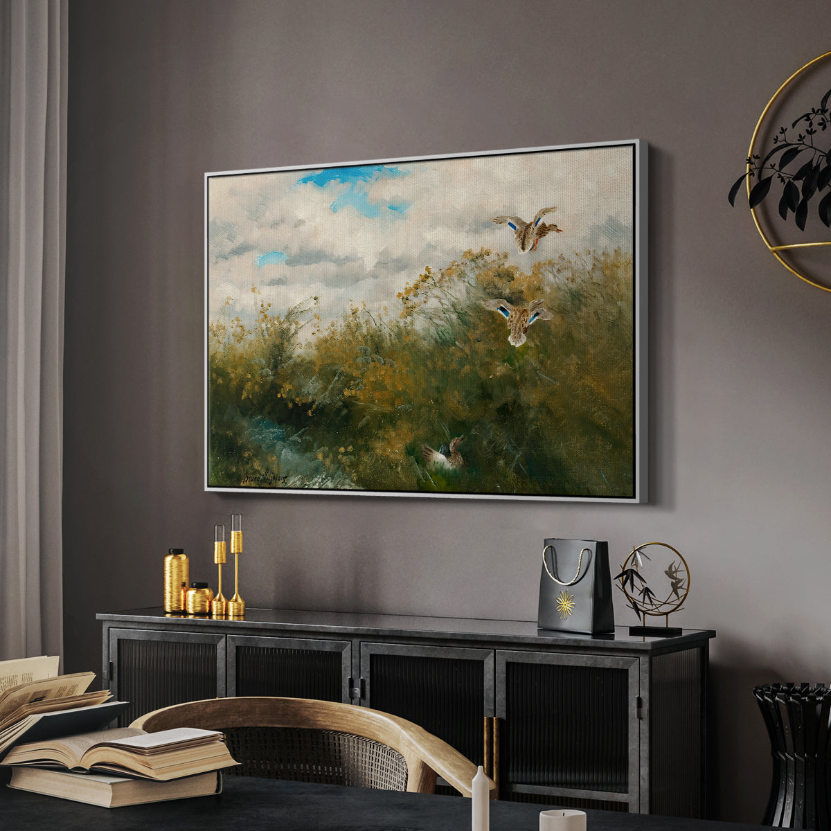 Wild Ducks (Grasänder), 1890 by Bruno Liljefors in a white floater framed canvas featuring a group of ducks foraging in natural marsh setting, displayed above a desk in a dark home office interior.
