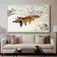 Fox in Snow Landscape, 1900 by Bruno Liljefors displayed in a white floater framed canvas above a sofa in a clean living room.