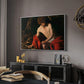 Saint John the Baptist in the Wilderness, c. 1603-1604 by Caravaggio in a white floater framed canvas featuring a biblical youth seated outdoors with symbolic staff and minimal landscape, displayed above a desk in a dark home office interior.