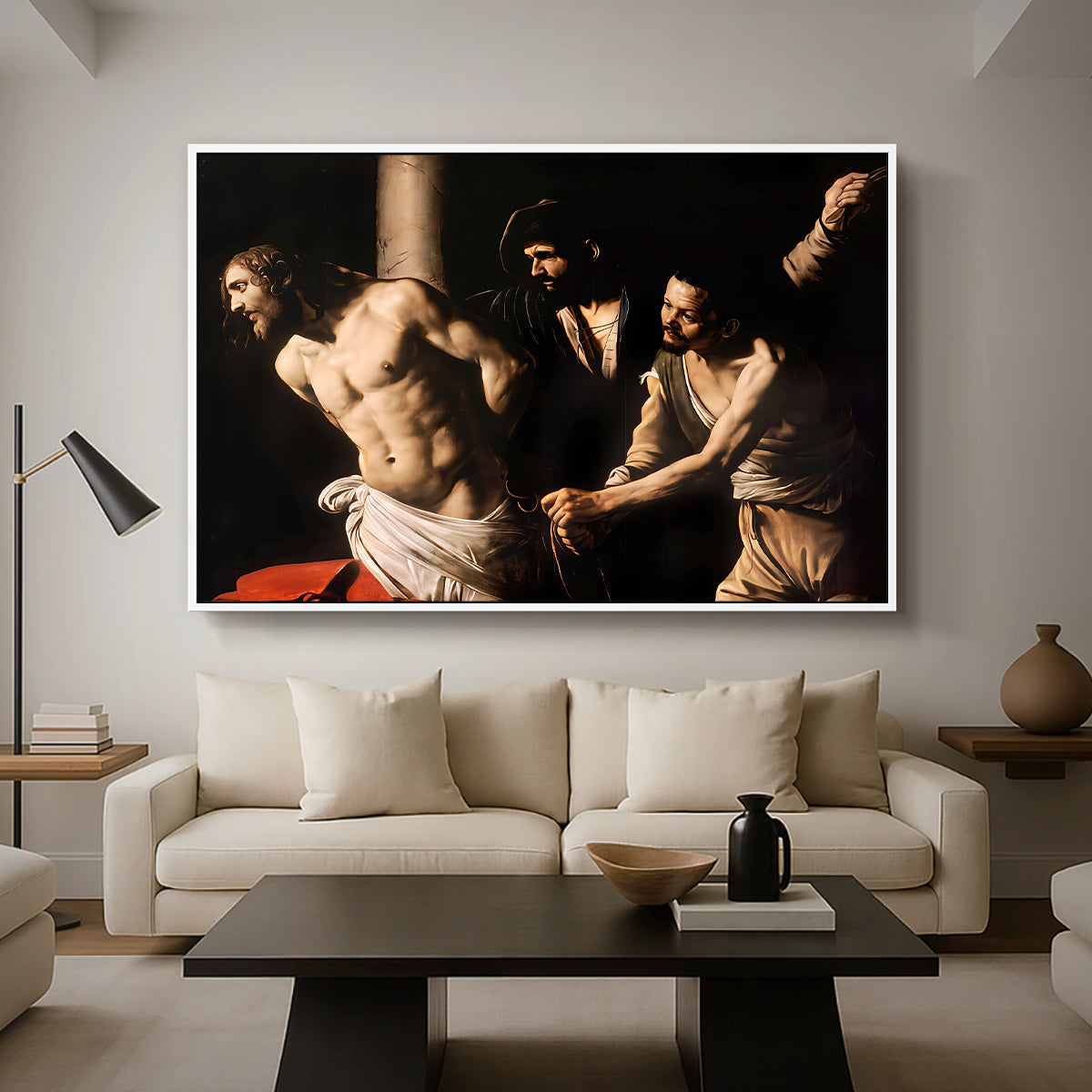 The Flagellation of Christ at the Column (Rouen Version), 1606 by Caravaggio as a white floater framed canvas featuring Christ bound to column while being whipped by surrounding figures, displayed above a sofa in a modern living room.