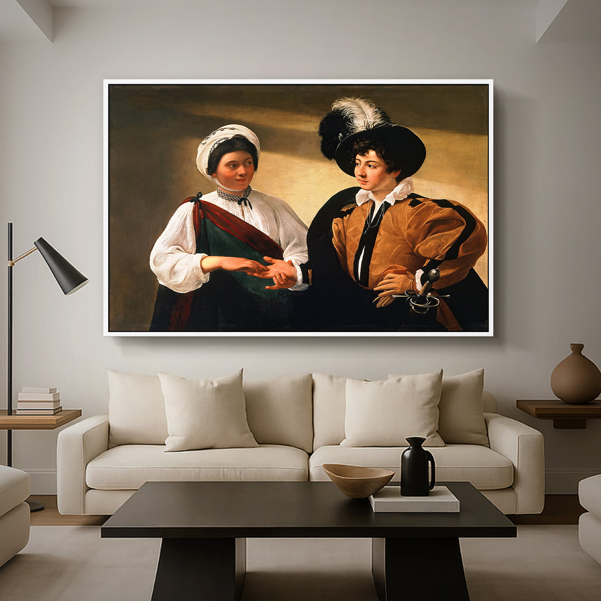 The Fortune Teller (Louvre Version), c. 1595 by Caravaggio as a white floater framed canvas featuring a woman reading a young man's palm while secretly stealing his ring, displayed above a sofa in a modern living room.